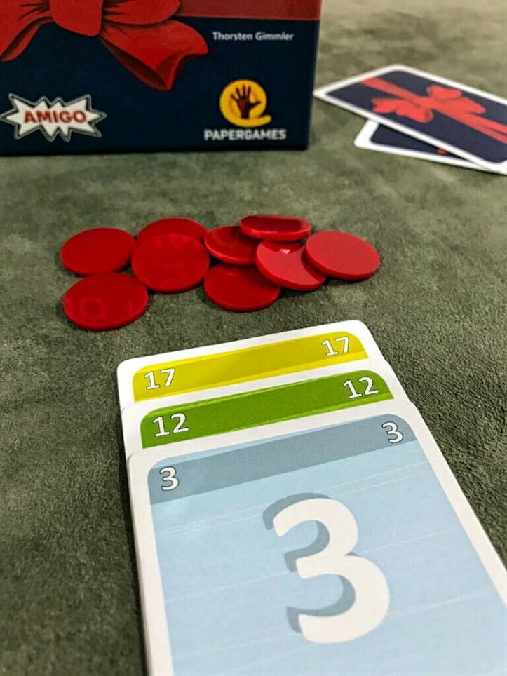 Suas cartas e fichas no jogo No Thanks!