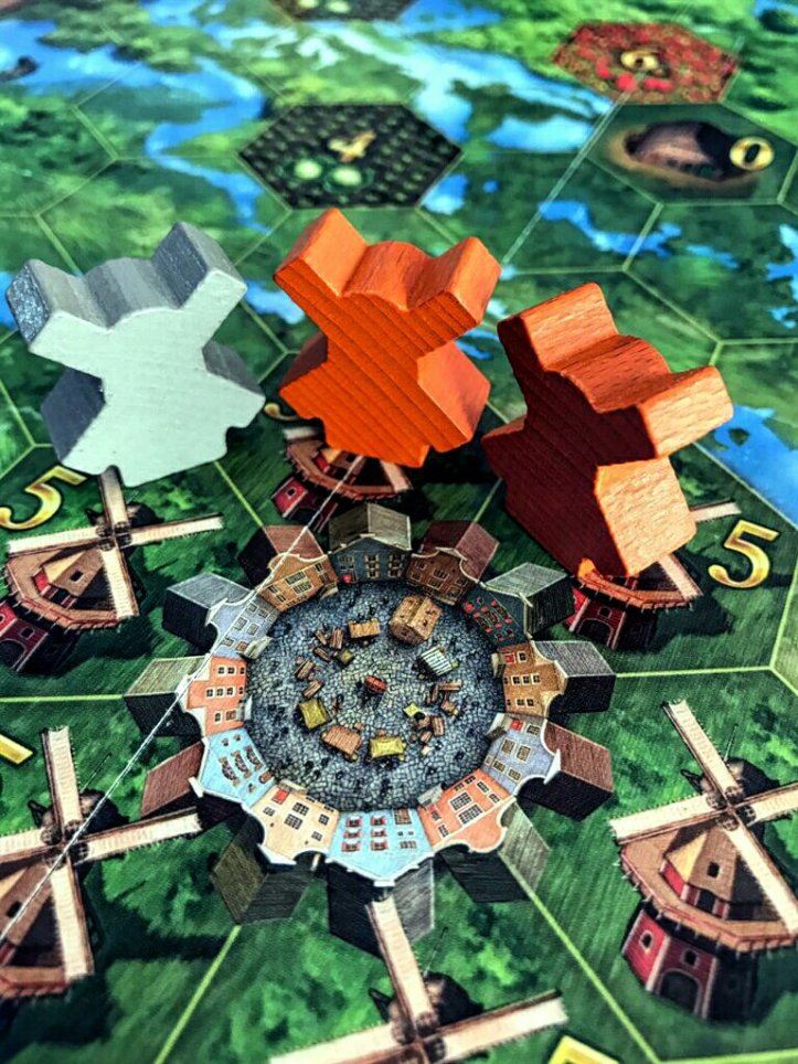 O centro da cidade e os moinhos no jogo de tabuleiro Seeland