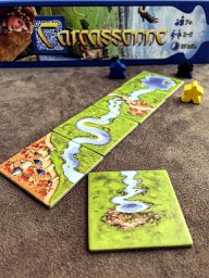 Mini expansão Rio no jogo de tabuleiro Carcassonne