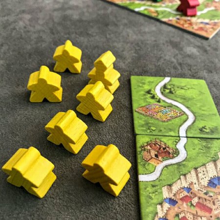 Seu exército de meeples no jogo de tabuleiro Carcassonne