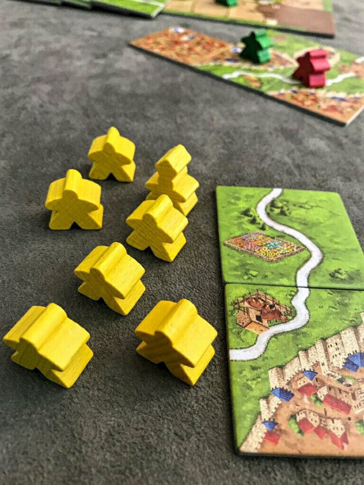 Seu exército de meeples no jogo de tabuleiro Carcassonne